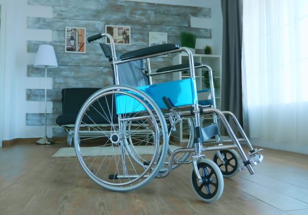 Wheelchair for disabled patient in empty room